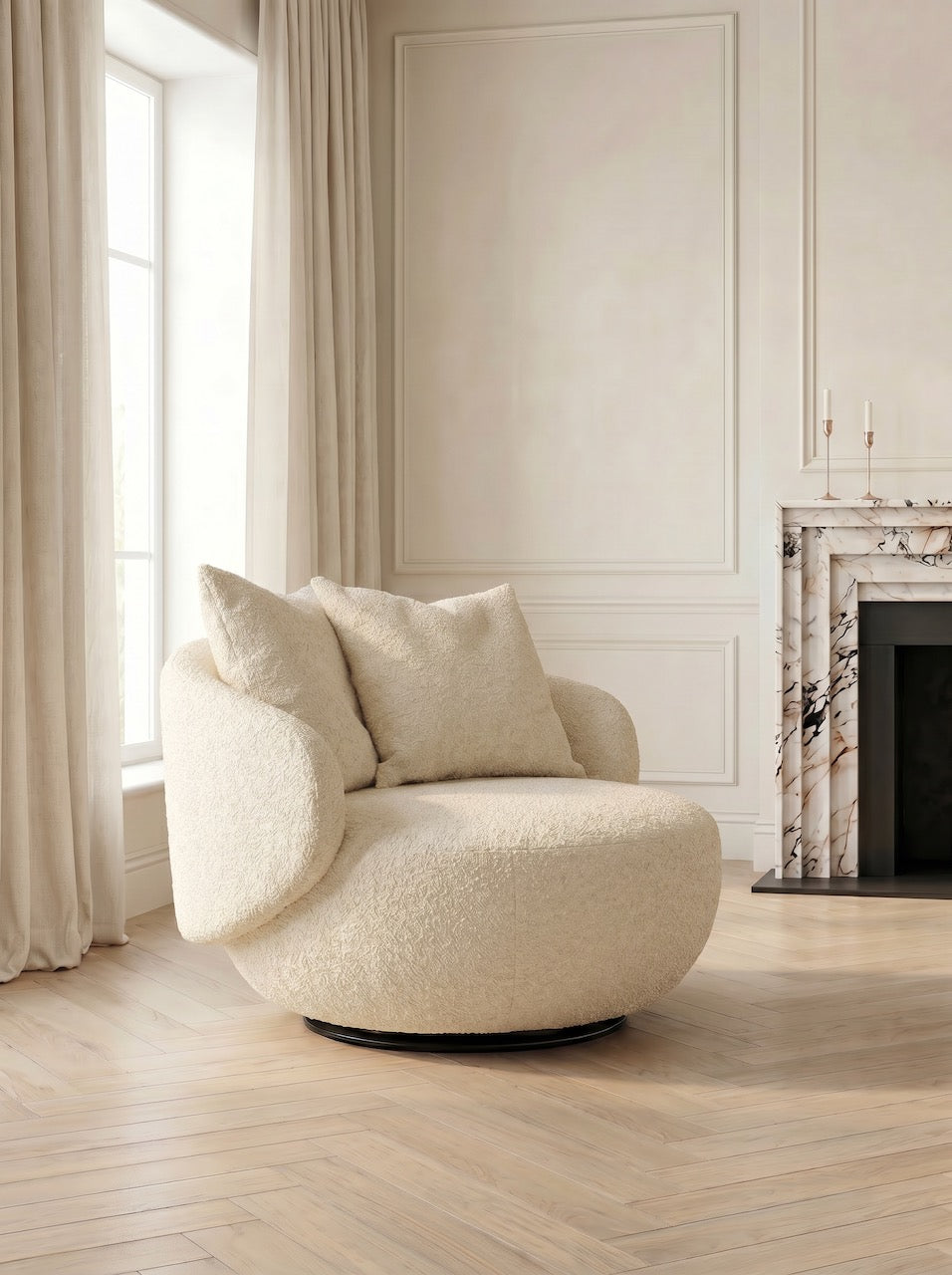 Cream-colored armchair in a room with light wood flooring and a fireplace.