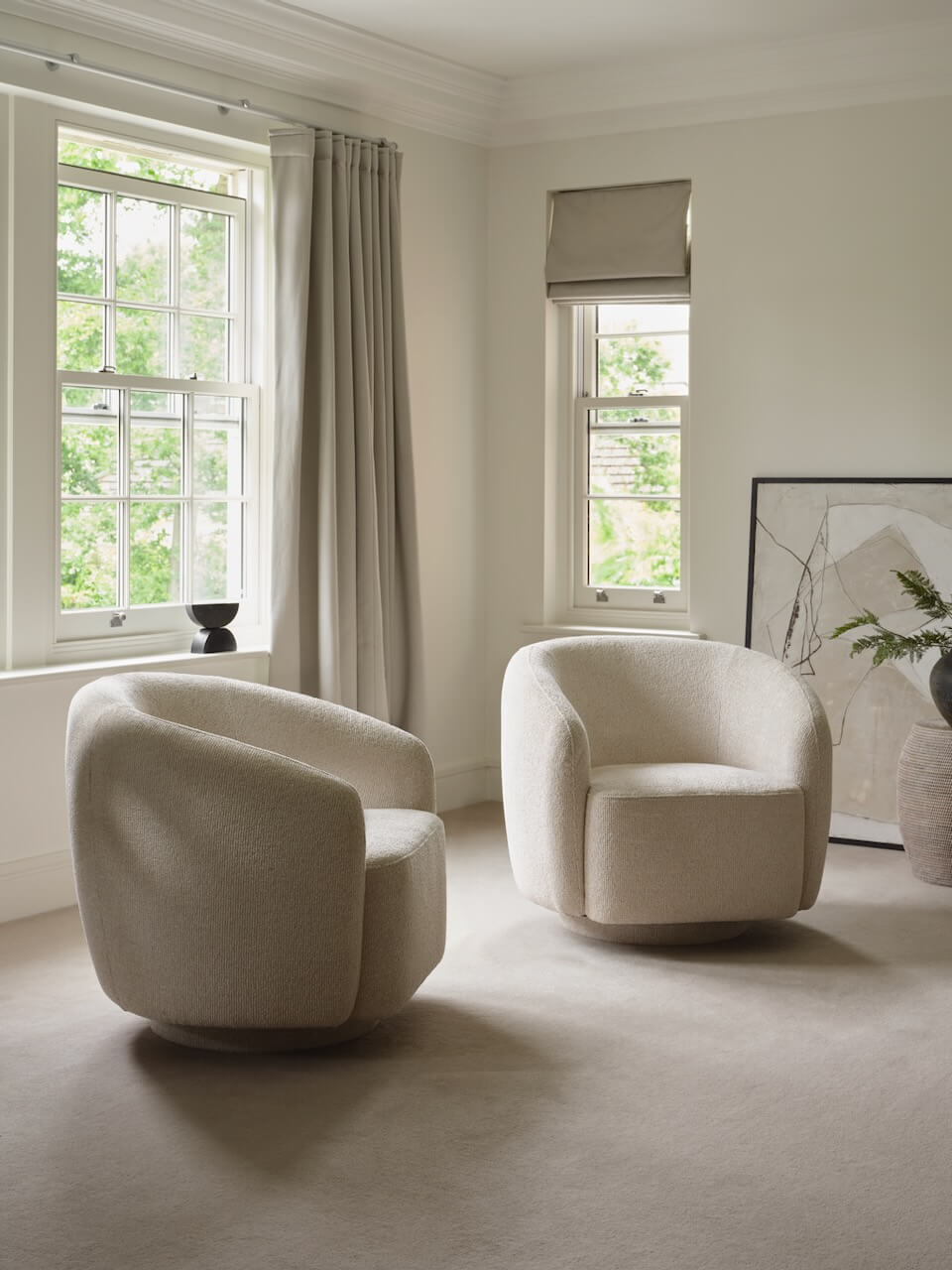 Layered Lounge upholstered armchair in a softly layered interior