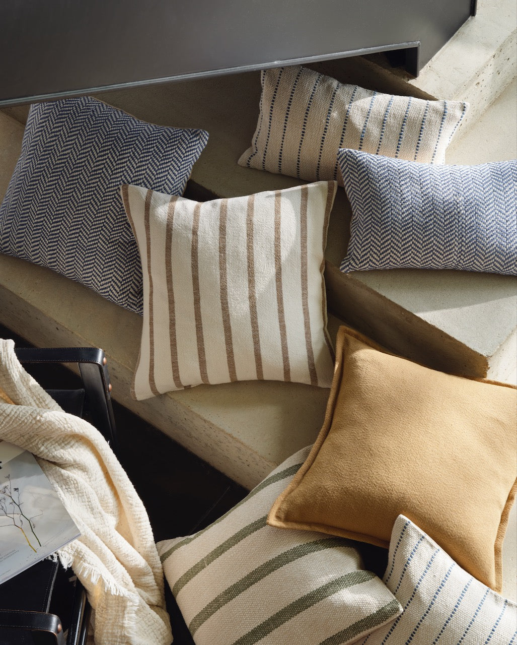 Layered cushions bringing softness and texture to a considered home