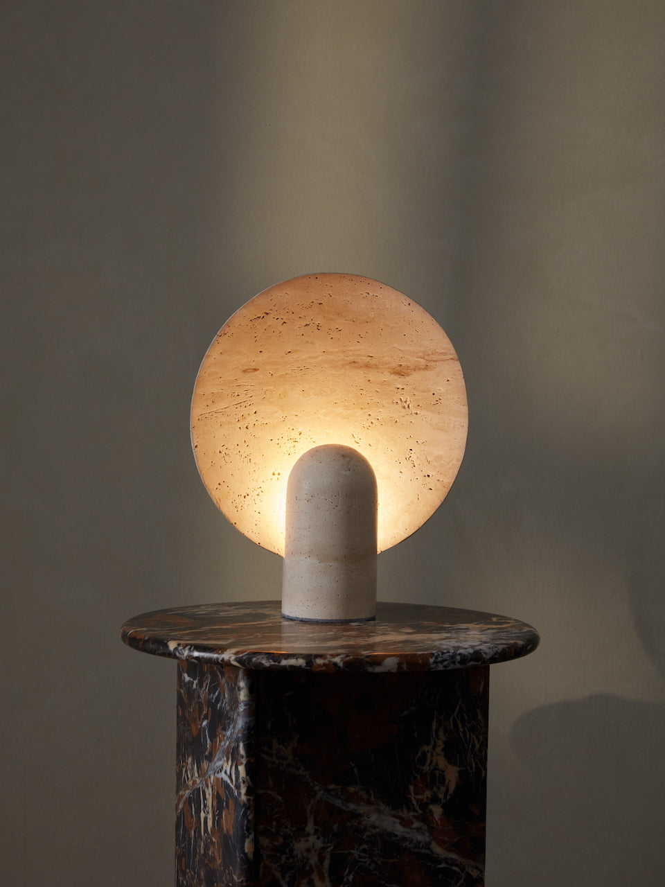 Warm layered lighting in a relaxed Layered Lounge interior