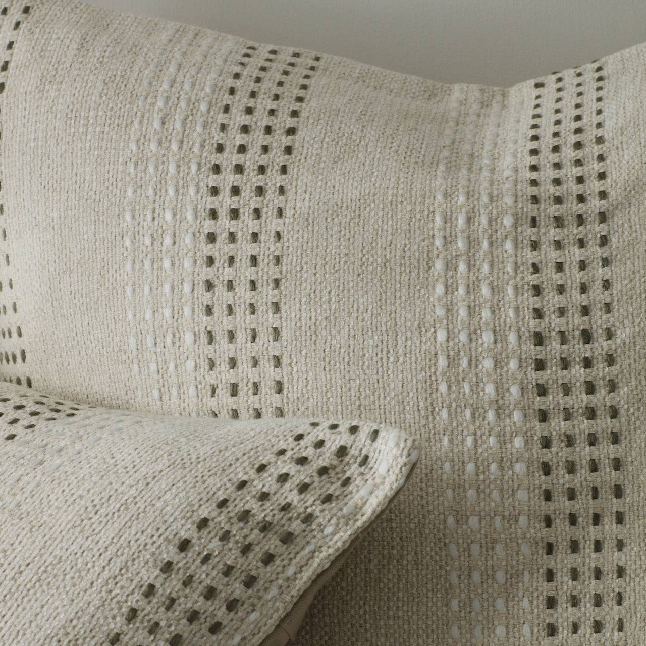 Detailed close up of green ticking stripe cushion cover by Layered Lounge 